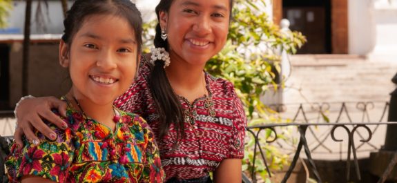 Portrait,Of,Happy,Indigenous,Girls,Smiling,,Looking,At,Camera.