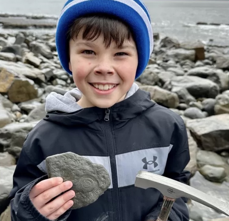 9-year-old-boy-discovers-200-million-year-old-ammonite-fossil-in-a-beach-cliff-american-chronicles