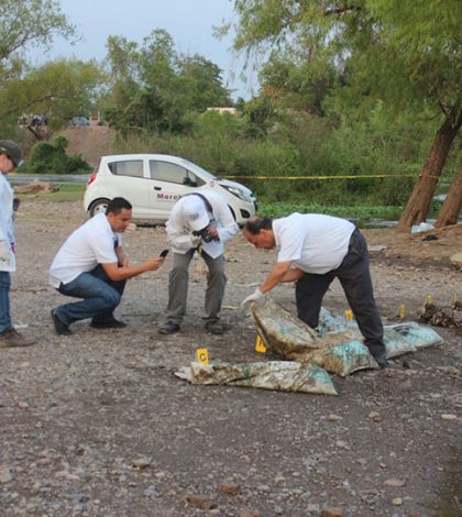 Hallan restos de siete personas en costales en río Humaya