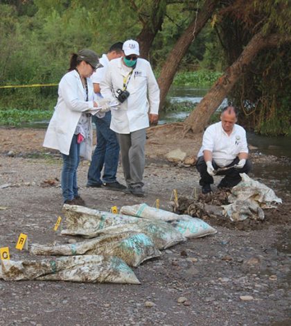 Hallan restos de siete personas  en costales en río Humaya