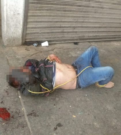 Balacera en Central de Abastos deja dos heridos, capturan y golpean al agresor (VIDEO y FOTOS)