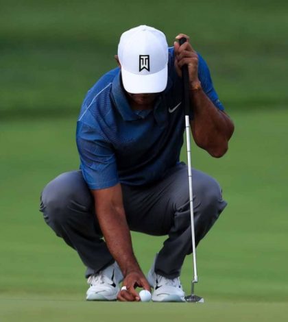 Tiger Woods se resiente  de la espalda